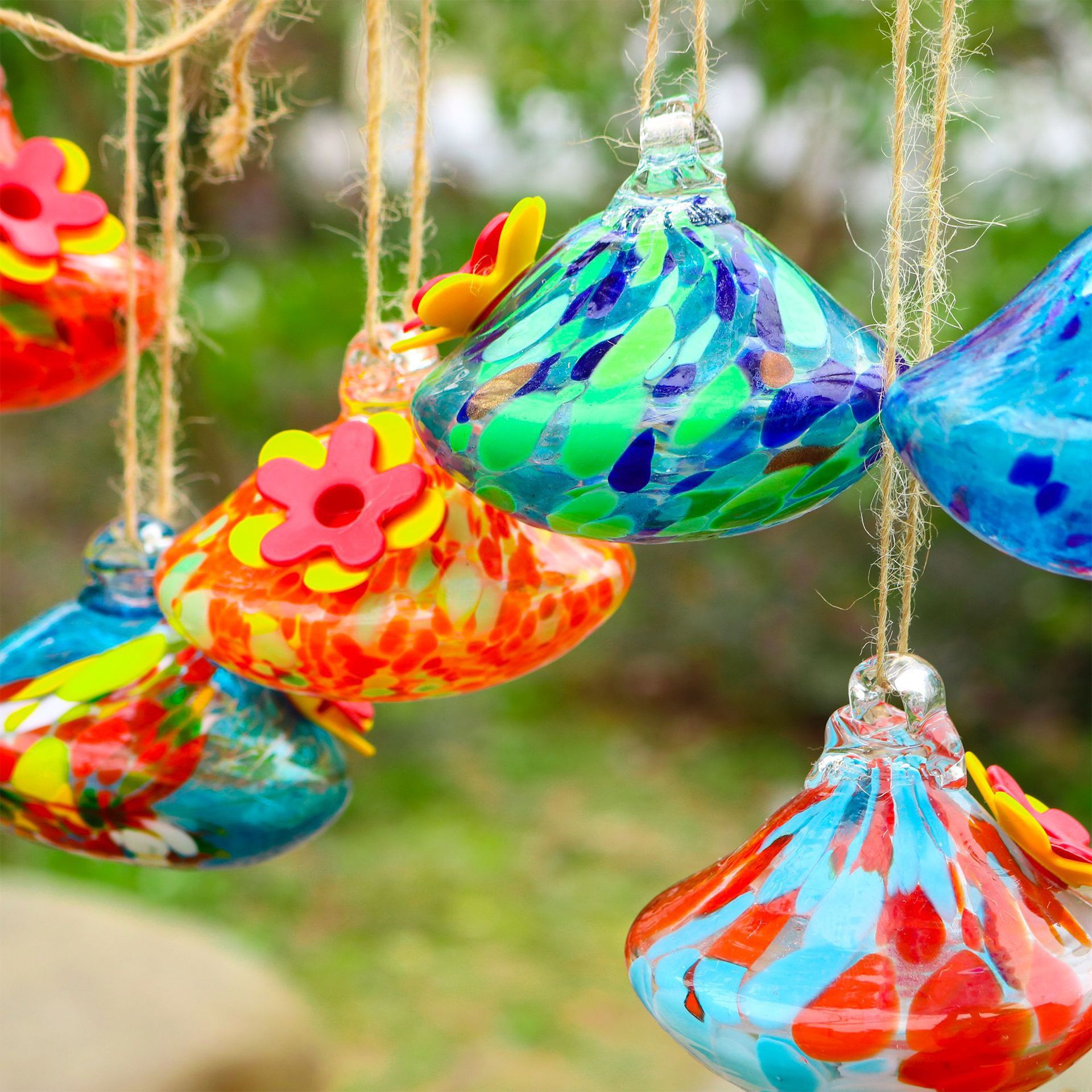 One Outdoor Courtyard With Glass Bird Feeder photo 1